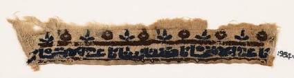 Textile fragment with inscription, possibly from a cufffront