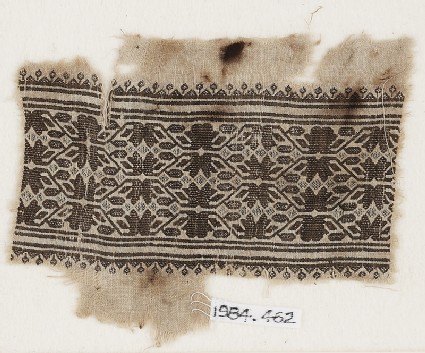 Textile fragment with vines, leaves, and flower-headsfront