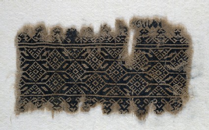 Textile fragment with interlocking hexagons and diamond-shapesfront