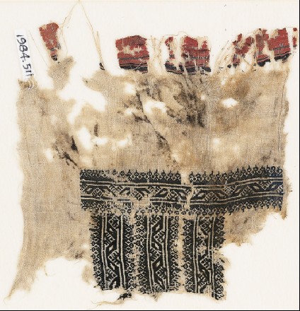 Textile fragment with three parallel bands with lozengesfront