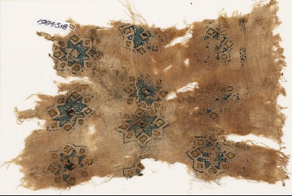 Textile fragment with stars and diamond-shapesfront
