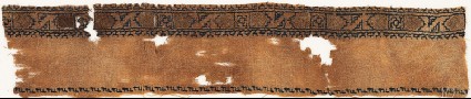 Textile fragment with band of Z-shapes and squaresfront