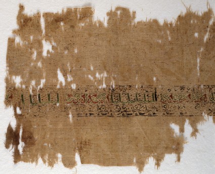Textile fragment with band of pseudo-inscription, leaves, and vinesfront
