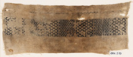 Textile fragment with band of diamond-shapes and chevronsfront