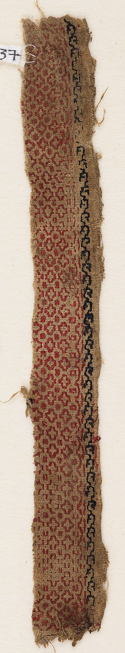 Textile fragment with cross-shaped diamonds and dotsfront