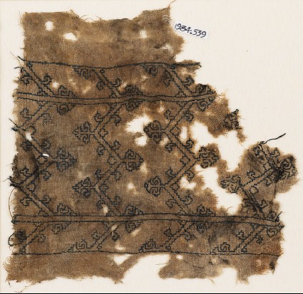 Textile fragment with chevrons and tendrilsfront