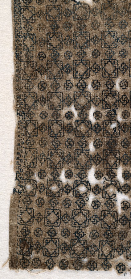 Textile fragment with squares and interlacing knotsfront