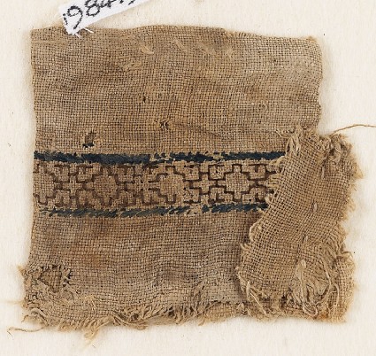 Textile fragment with stepped diamond-shapes, possibly from a money pouchfront