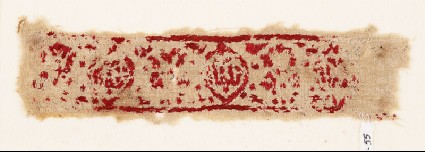 Textile fragment with medallions and ornamental inscriptionfront