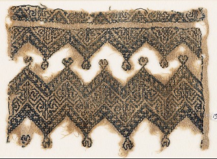 Textile fragment with chevrons and linked trefoilsfront