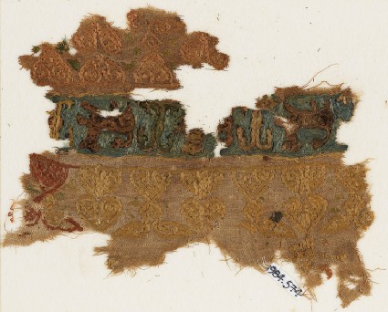 Textile fragment with prancing lions or leopardsfront