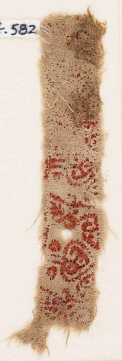 Textile fragment with row of trefoils surrounded by tendrilsfront