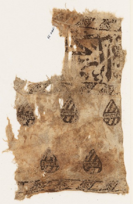 Textile fragment with blazons and remains of naskhi inscriptionfront
