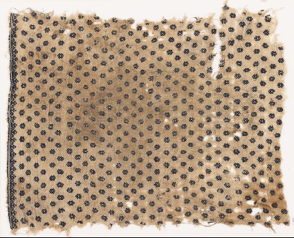 Textile fragment with diamond-shapes and a border of heart-shaped flowersfront
