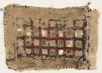 Textile fragment with rectangle containing squaresfront