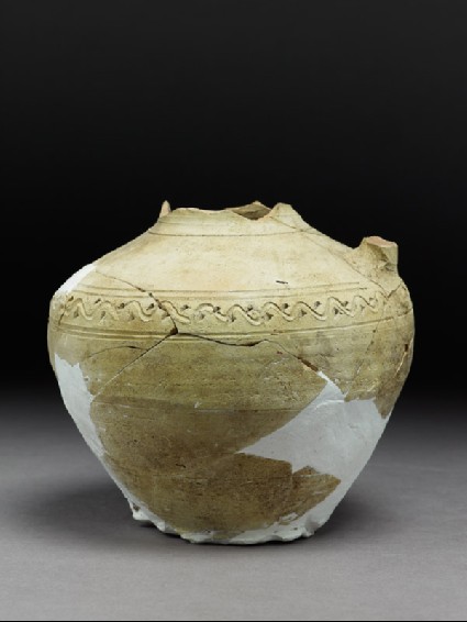 Fragmentary jar with incised decorationside