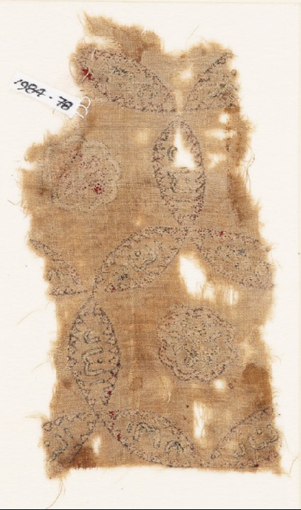 Textile fragment with linked circles, inscription, and possibly a lionfront