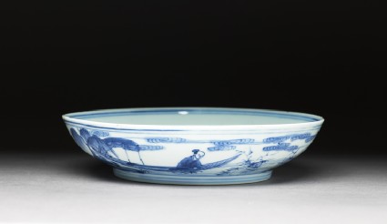 Blue-and-white dish with figures in a landscapeoblique