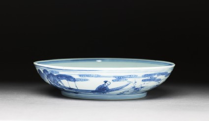 Blue-and-white dish with figures in a landscapeoblique