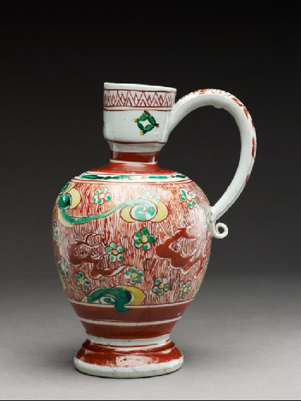 Jug with flowers and plants among cloudsside