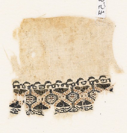 Textile fragment with pseudo-inscription borderfront