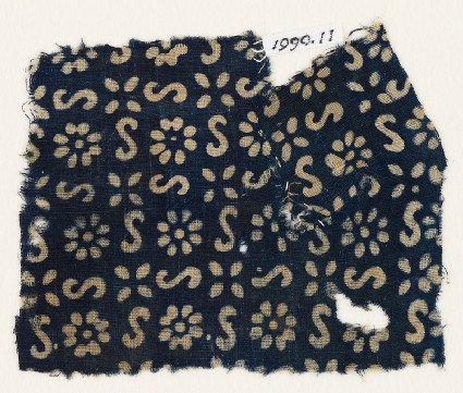 Textile fragment with S-shapes, rosettes, and flowersfront