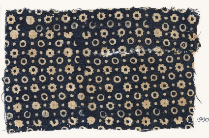 Textile fragment with rings, stars, and dotsfront