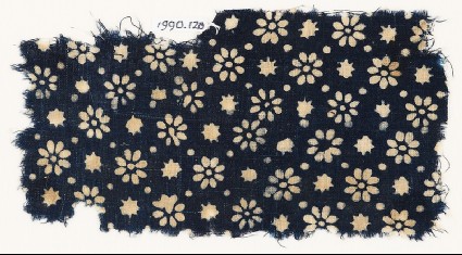 Textile fragment with rosettes, stars, and dotsfront