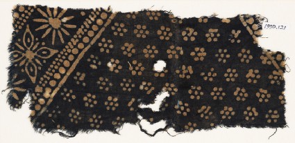 Textile fragment with rosettes and band with floral shapesfront