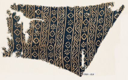 Textile fragment with vines, rosettes, and diamond-shapesfront