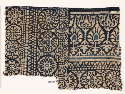 Textile fragment with rosettes, arches, stylized trees or flowers, and leavesfront