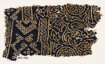 Textile fragment with rosettes, leaves, flowers, and bandhani, or tie-dye, imitationfront