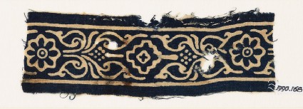 Textile fragment with rosettes, stylized leaves, and a diamond-shapefront