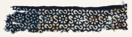 Textile fragment with S-shapes, rosettes, and flowersfront