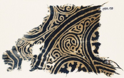 Textile fragment with swirling tendrilsfront