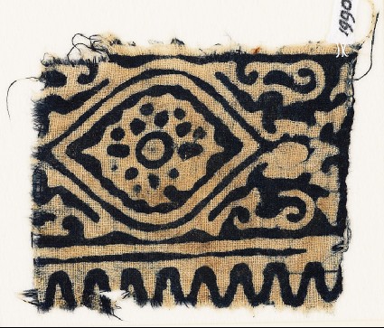 Textile fragment with medallion, flower, and tendrilsfront