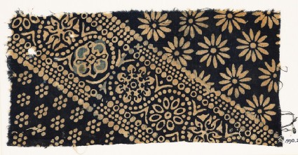 Textile fragment with ornate, dotted, and large rosettesfront