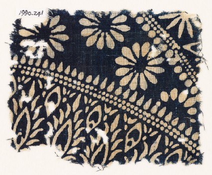 Textile fragment with rosettes and stylized plantsfront