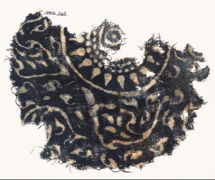 Textile fragment with medallion, rosette, and stylized leavesfront