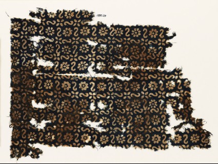 Textile fragment with S-shapes, rosettes, and flowersfront