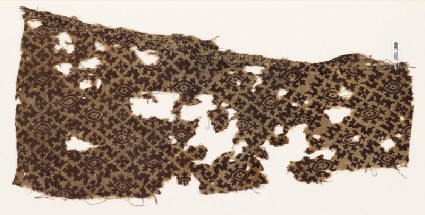 Textile fragment with medallions and small crossesfront