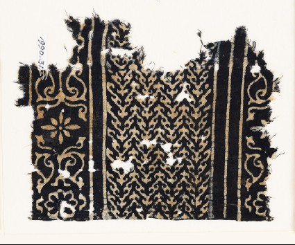 Textile fragment with linked chevrons, flowers, and leavesfront