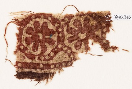 Textile fragment with two rosettesfront