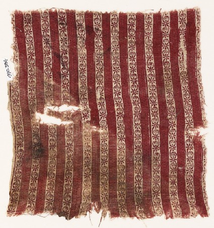 Textile fragment with bands of flowersfront