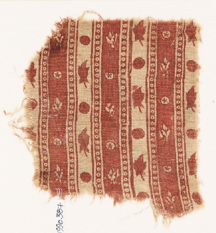 Textile fragment with bands of flowers and circlesfront