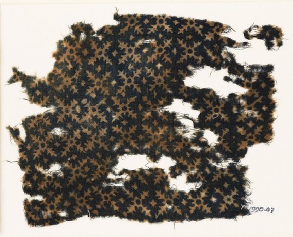 Textile fragment with serrated crossesfront