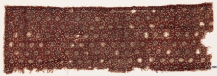 Textile fragment with rosettes and stylized tendrilsfront