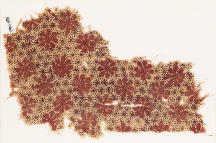 Textile fragment with large and very small rosettesfront