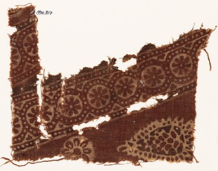 Textile fragment with rosettes in dotted frames, and a tear-dropfront