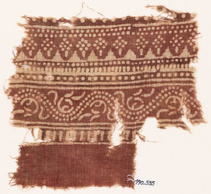 Textile fragment with bands of dotted patterns and vinefront
